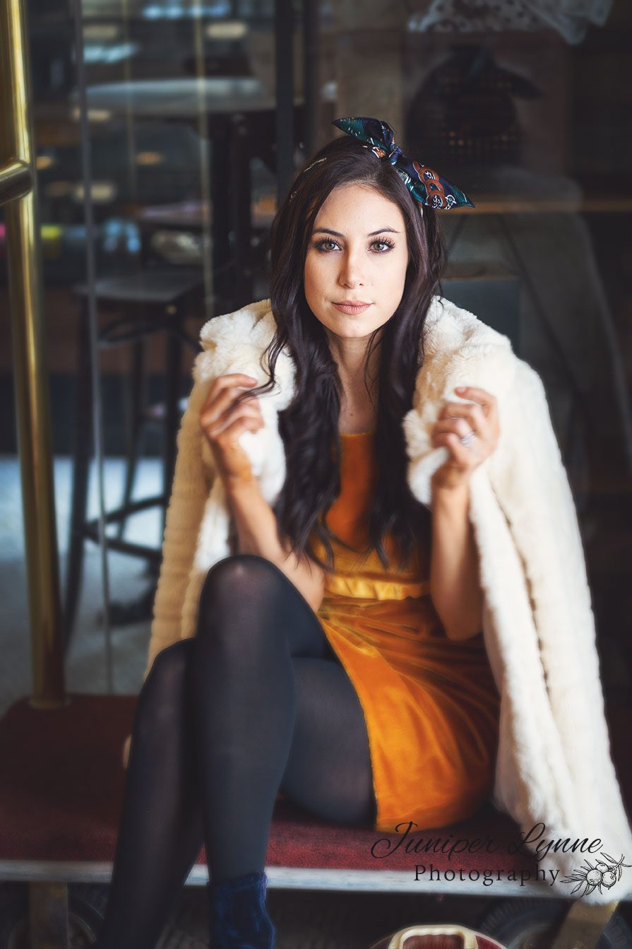 Beautiful woman in hotel lobby for vintage styled fashion editorial photo shoot at Elms hotel by Juniper Lynne Photography located in Seattle Washington.