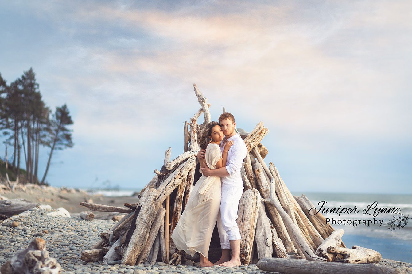 Romantic couple on beach at Ruby beach for destination photo session by Juniper Lynne Photography.