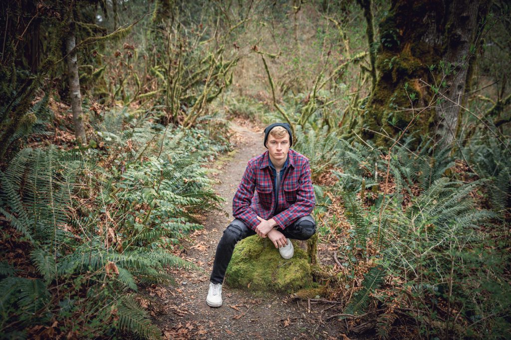 class of 2020 high school senior boy PNW Manchester State Park in Port Orchard in woods with flannel by juniper Lynne photography of Gig Harbor Washington.