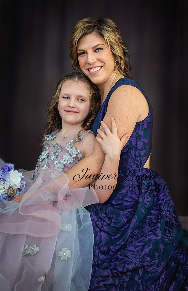 mother and daughter dressed in purple for mama and me studio session with juniper lynne photography in Tacoma giveaway