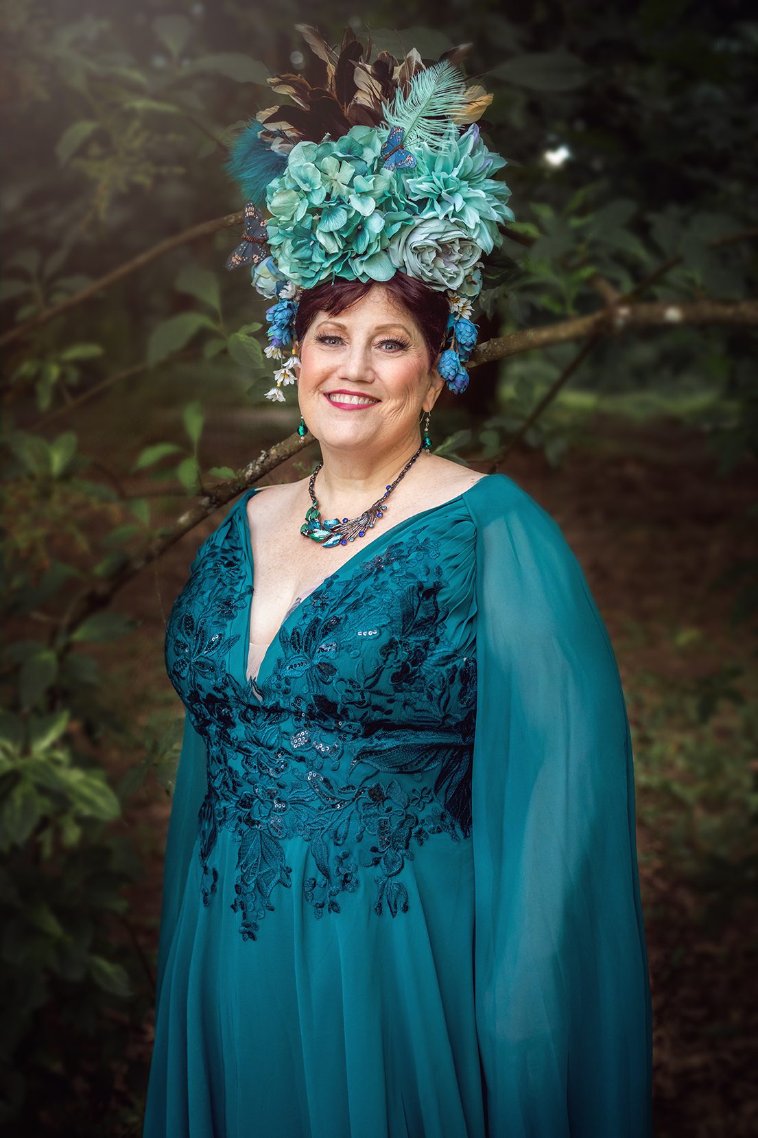 Over 50 woman in gown and head piece in western washington forest for juniper Lynne photography.