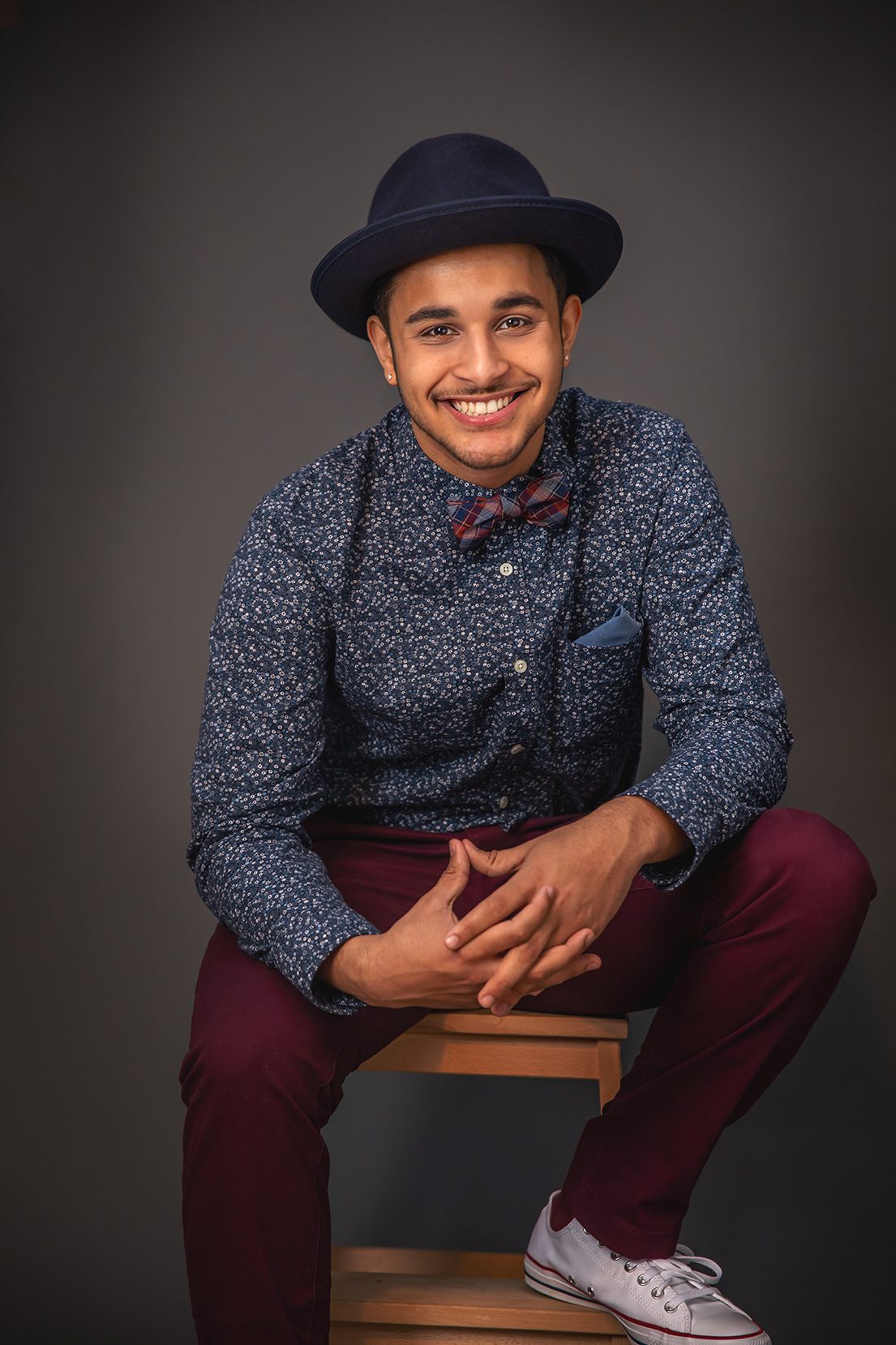 young man in hat for headshot