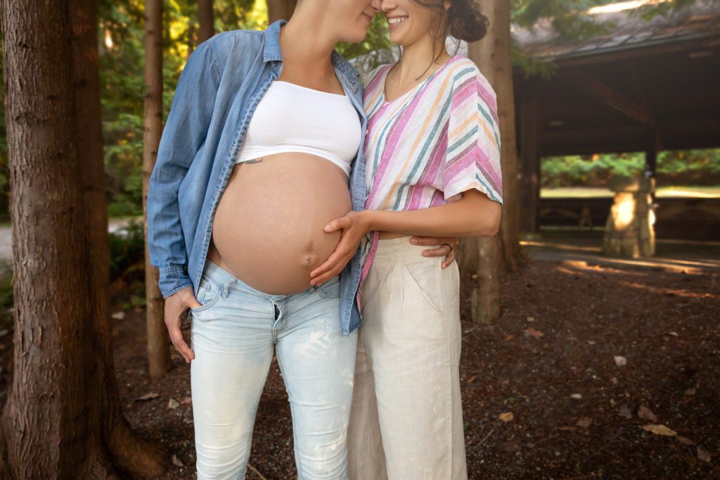 pregnant same sex lesbian couple in park for maternity session