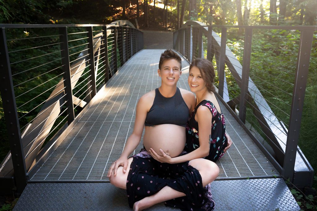 lbgtq couple on bridge for maternity session in Kitsap County Washington.
