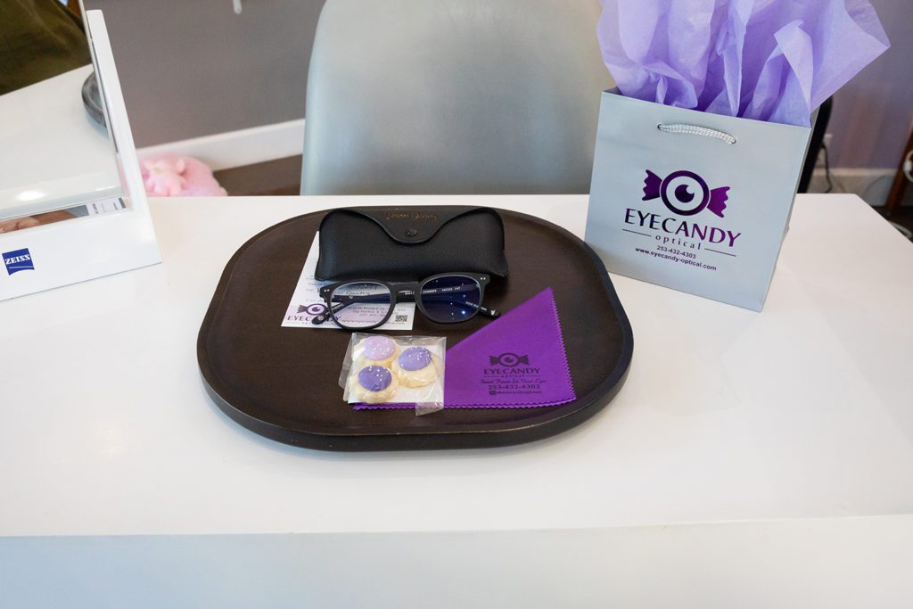 eye glasses on a table at Eye Candy Optical in Uptown Gig Harbor Washington