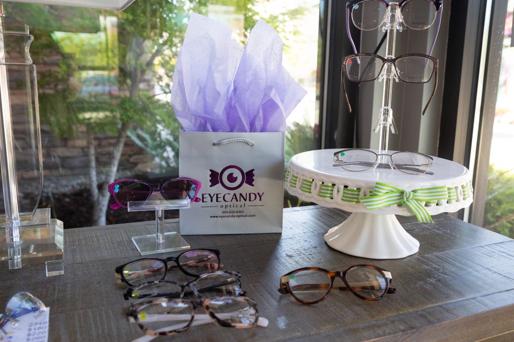 Eye glass frames set on table with eye candy optical bag 